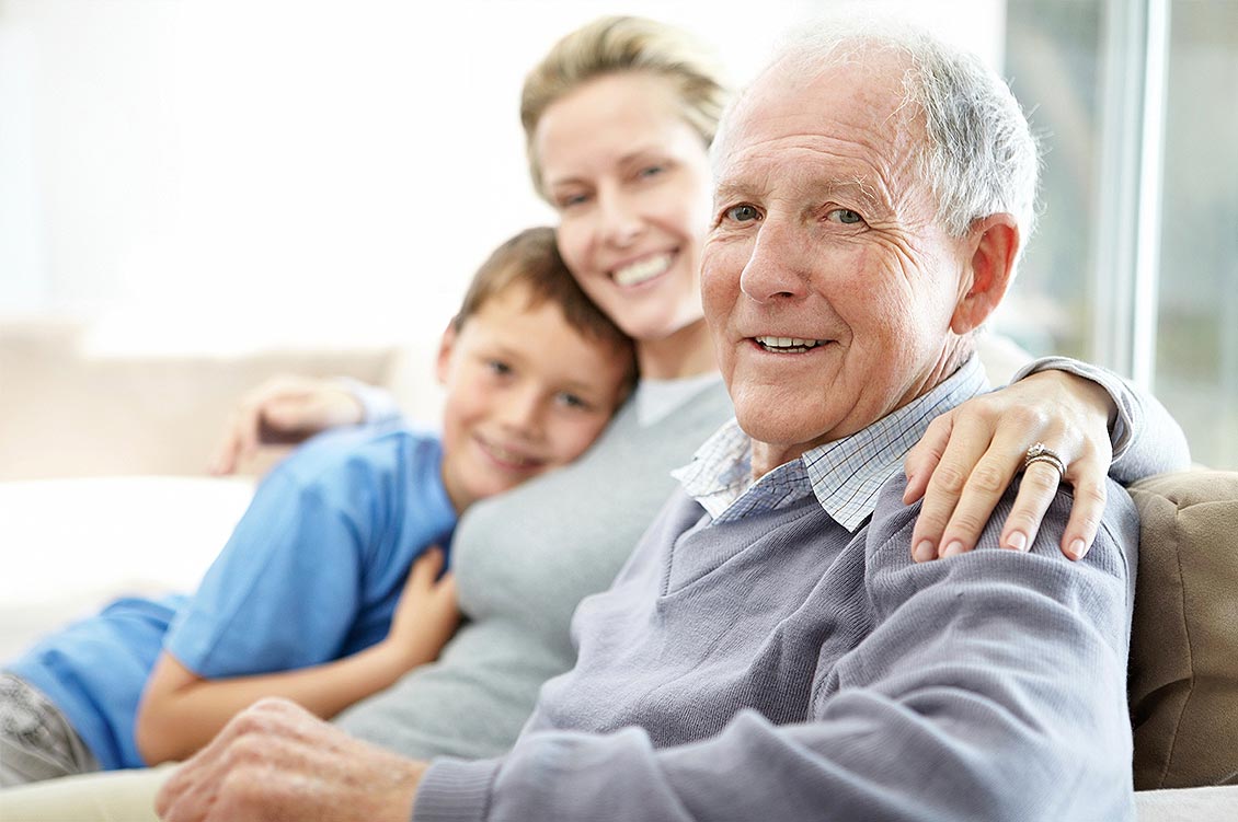 An older man sits with his daughter and grandson | Soundview Medical Supply
